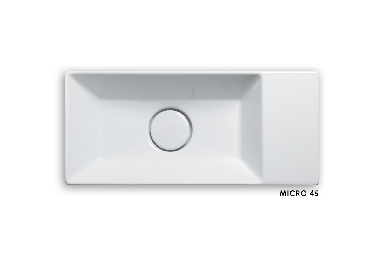 Rechteckige weiße Keramikspüle mit zentralem Abflussloch, dargestellt von oben auf weißem Hintergrund. Die Aufschrift MICRO 45 erscheint in der rechten unteren Ecke.