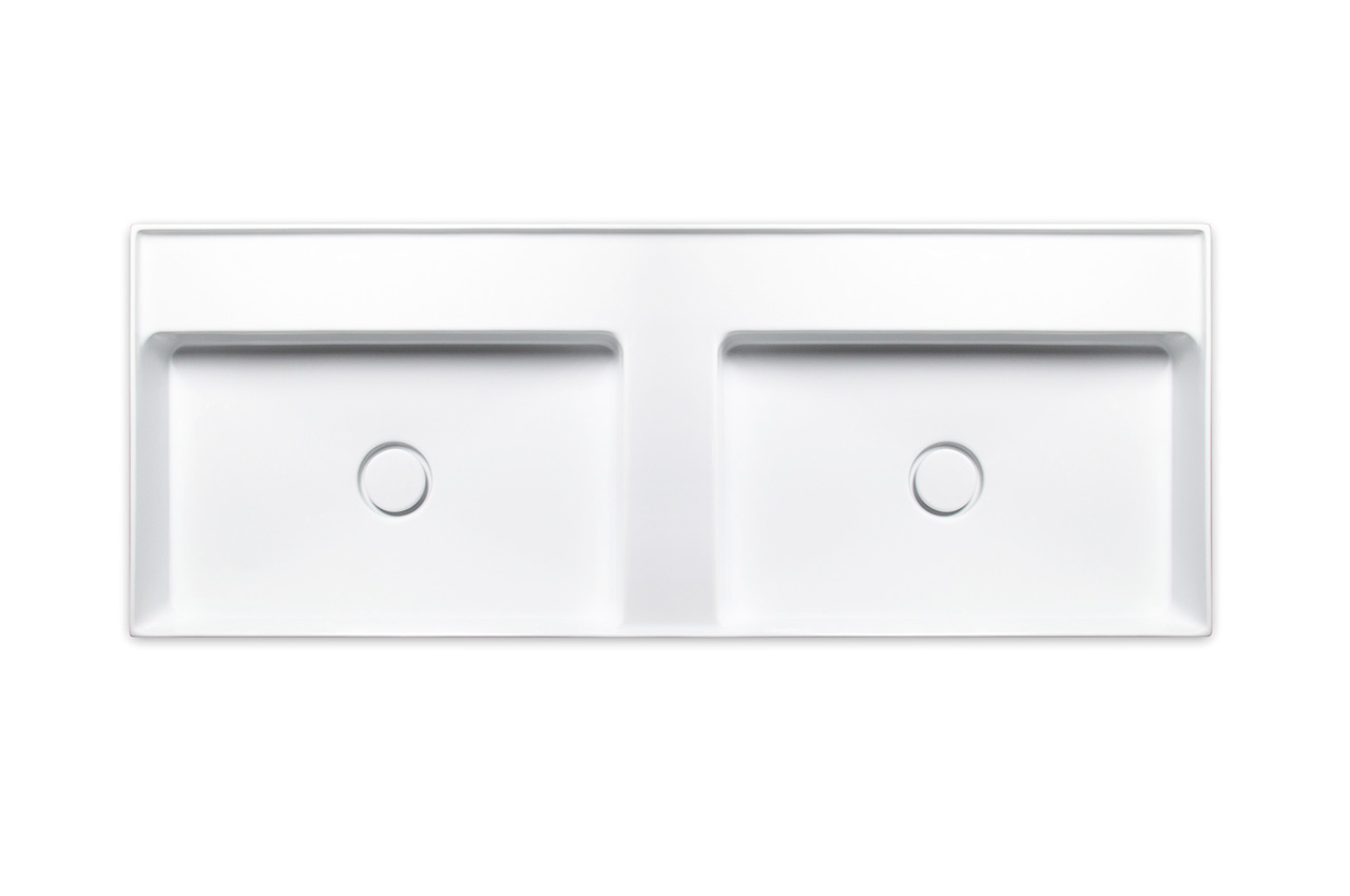 Draufsicht auf ein modernes, rechteckiges weißes Waschbecken mit zwei getrennten Becken und zwei Abflussöffnungen vor einem schlichten weißen Hintergrund.