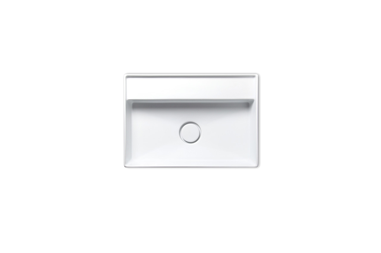 Rechteckiges weißes Waschbecken mit klaren, modernen Linien und einem mittigen Abflussloch, von oben auf einem schlichten weißen Hintergrund fotografiert.